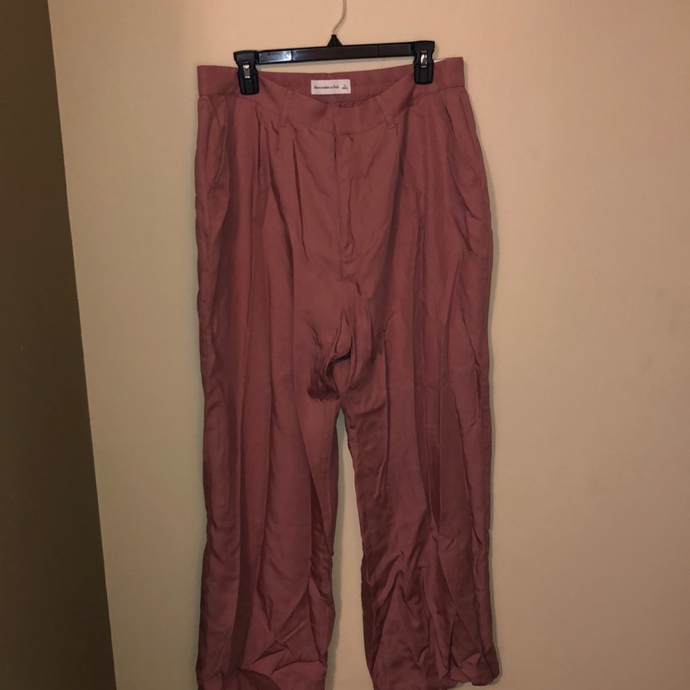 Dark pink, height waisted, wide leg trousers.